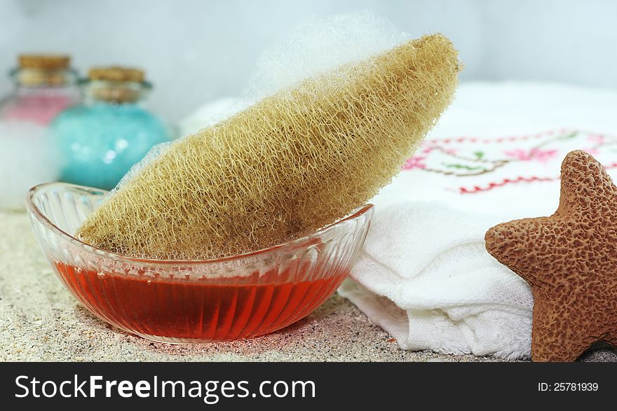 Loofah, bath salts and aromatic liquid soap for use in the spa