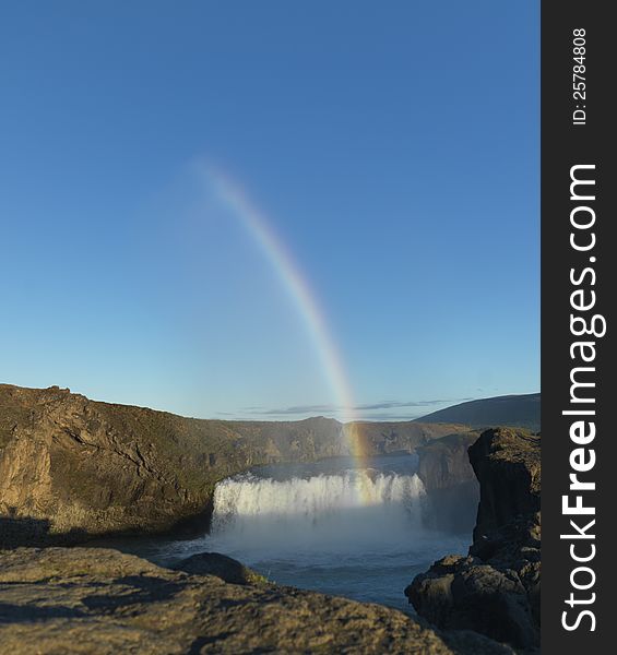 Rainbow over waterfall in iceland