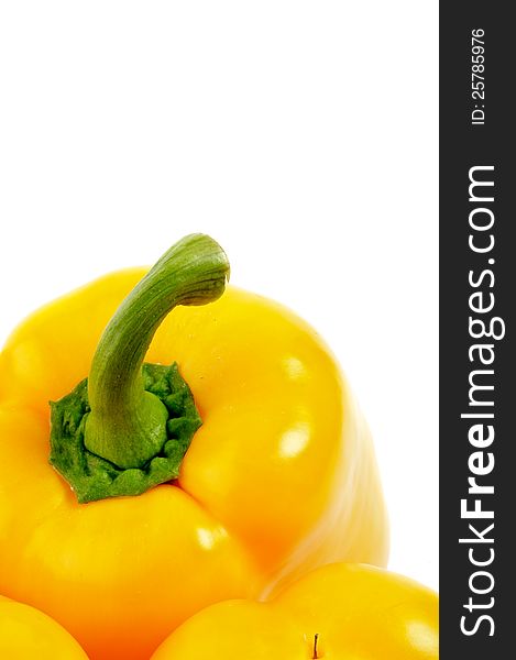 Yellow Bell Pepper with fresh tail close up on white background