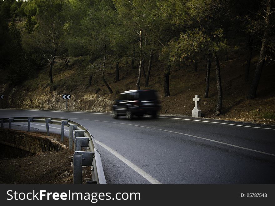 A car driving on a dangerous curve