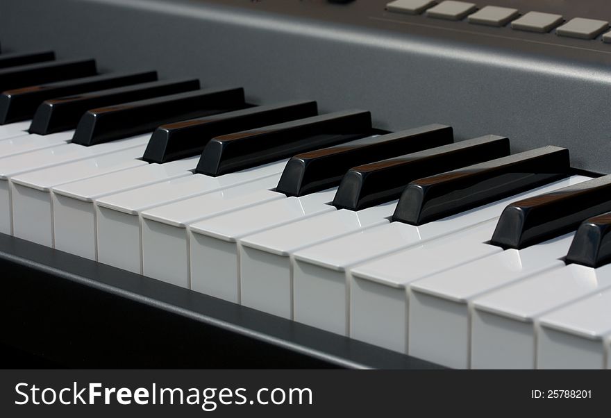 Modern electronic piano keyboard close-up