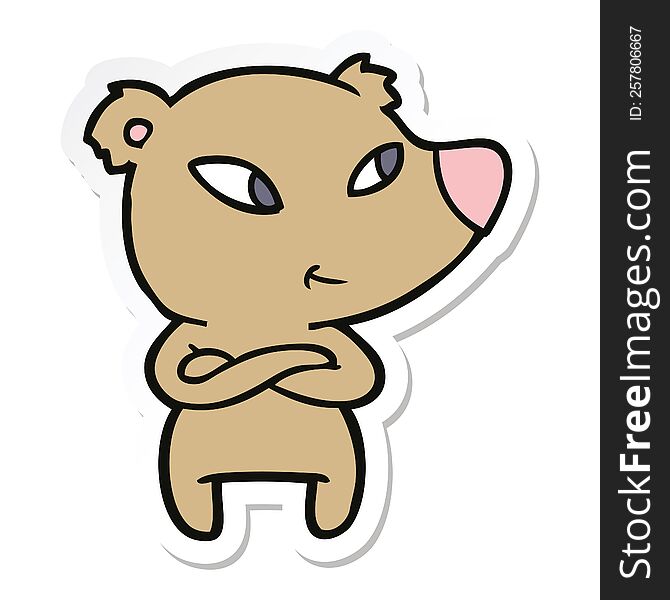 sticker of a cute cartoon bear with crossed arms