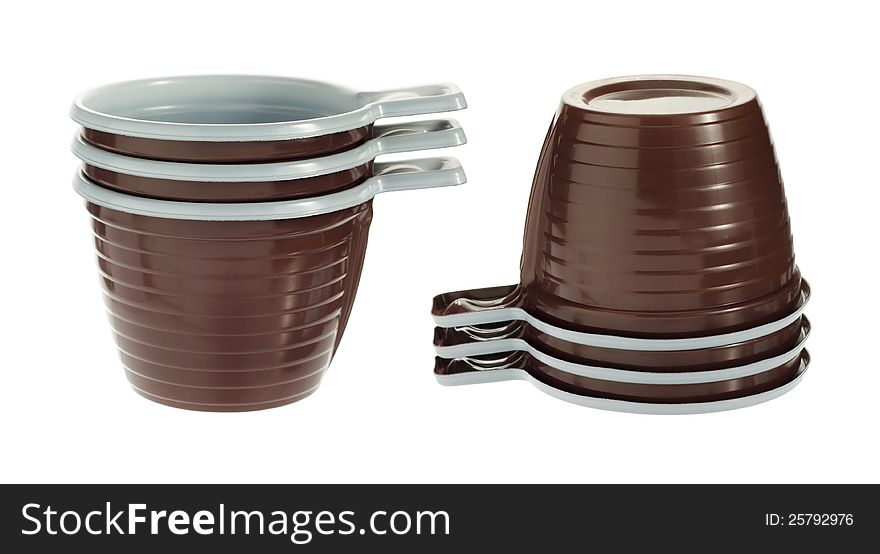 Pile of empty disposable plastic brown coffee cups isolated on white background. Pile of empty disposable plastic brown coffee cups isolated on white background