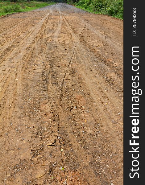 Traces of the wheels of cars and motorcycles on the roads in rural areas on the ground after a rain. Traces of the wheels of cars and motorcycles on the roads in rural areas on the ground after a rain.