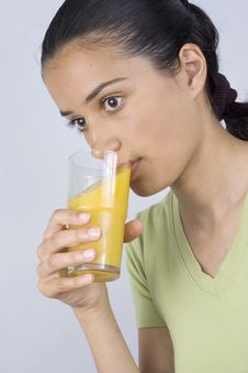 Girl Drinking Juice Royalty Free Stock Photography