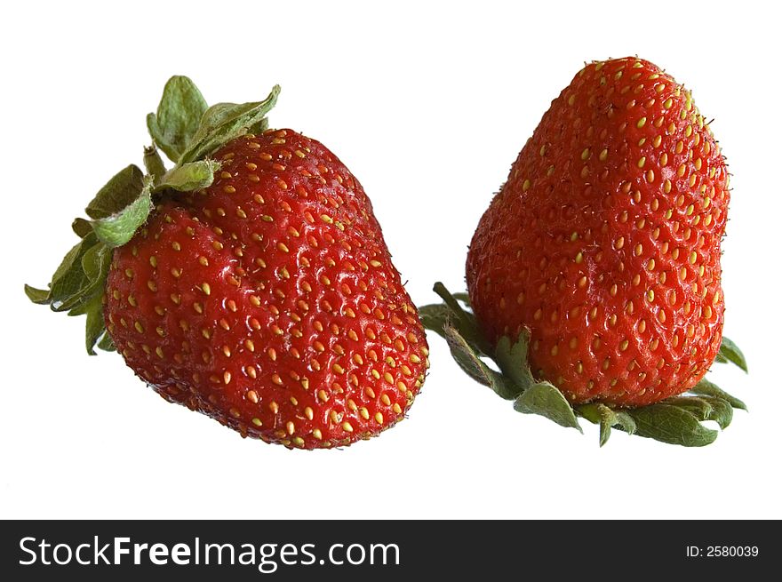 Close-up of two strawberries on white