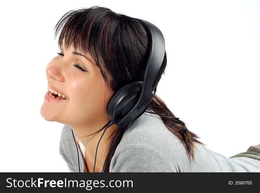 Attractive woman with headphones isolated on white background. Attractive woman with headphones isolated on white background