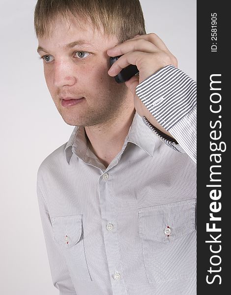 Young businessman talking on cellphone