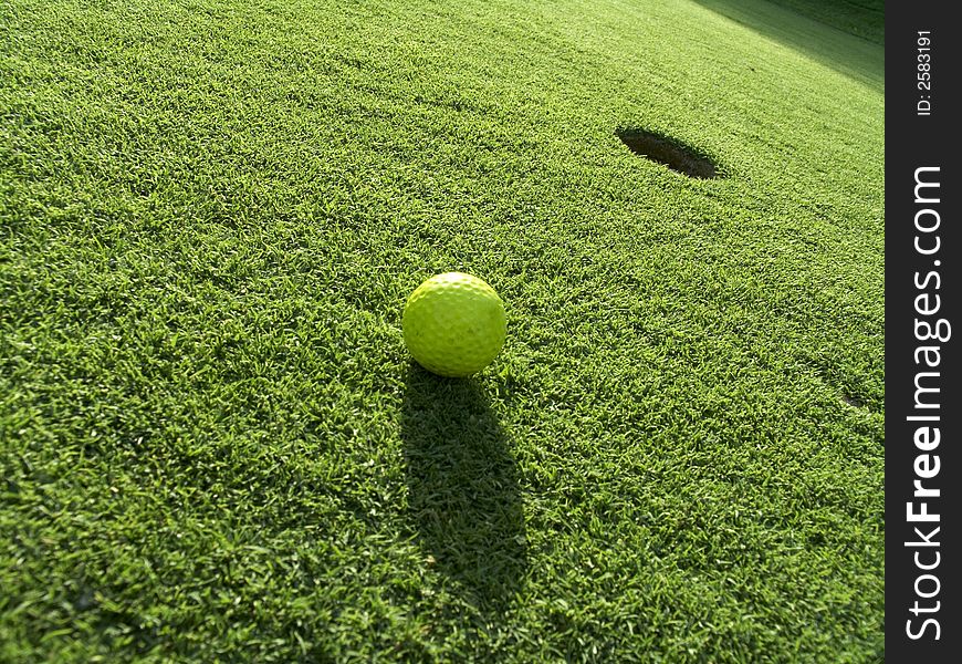 Yellow golf's ball near the 18th hole