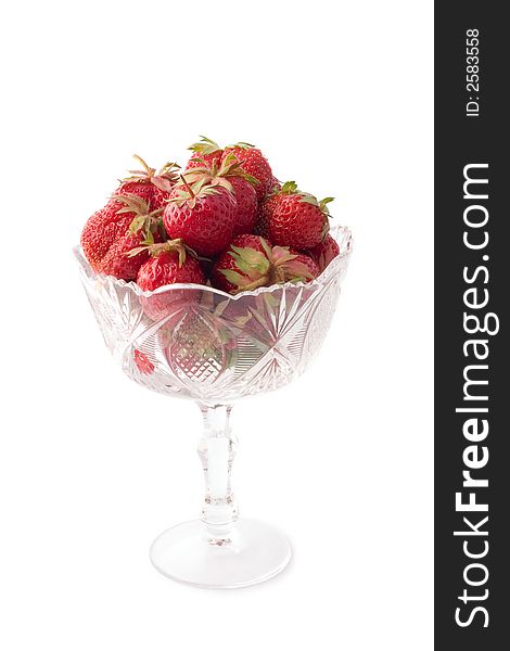 Vase with strawberries isolated on white with shadows