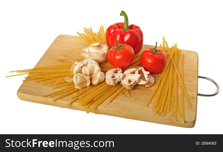 Fetuccini and ingredients on a cutting board. Fetuccini and ingredients on a cutting board