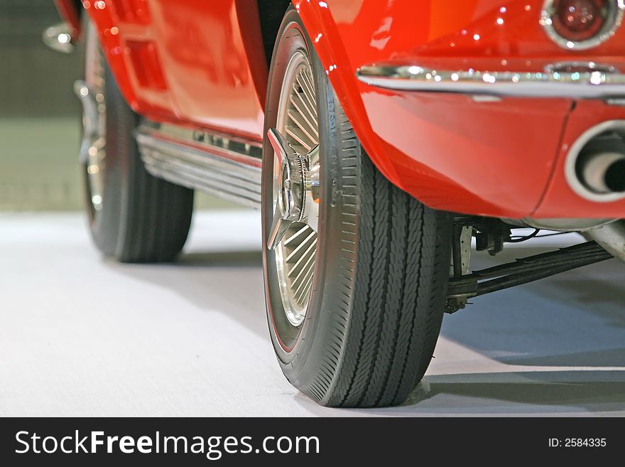 Close up of the wheels of an old sports car, with selective focus. Close up of the wheels of an old sports car, with selective focus