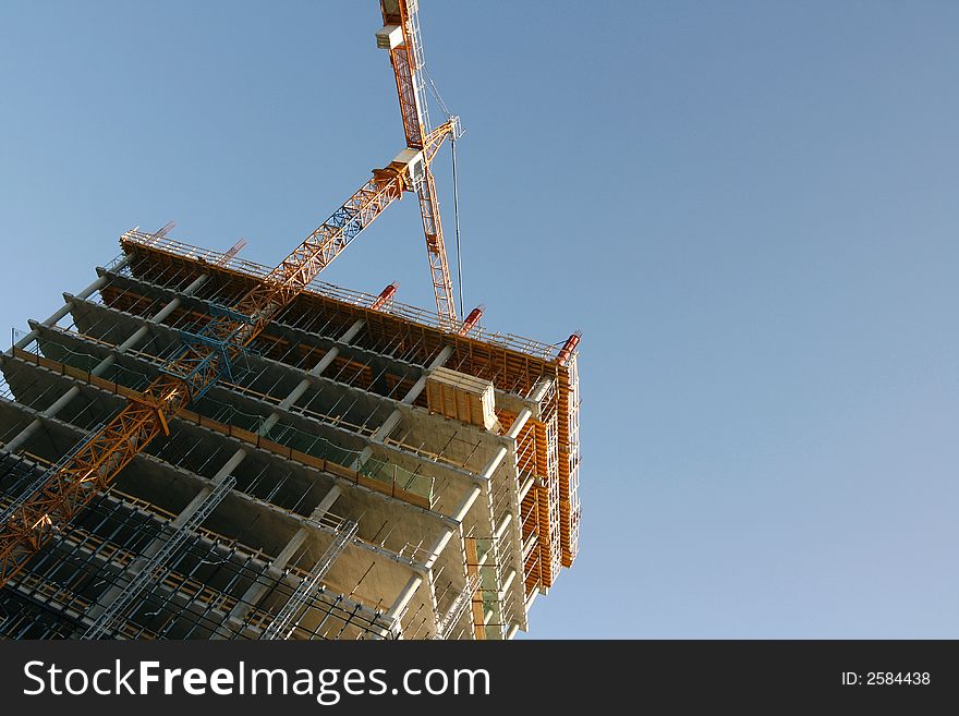 Large building under construction with scaffold