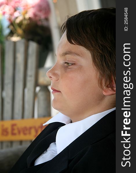 An adolescent boy sitting on a porch contemplating his teen years and life in general. An adolescent boy sitting on a porch contemplating his teen years and life in general