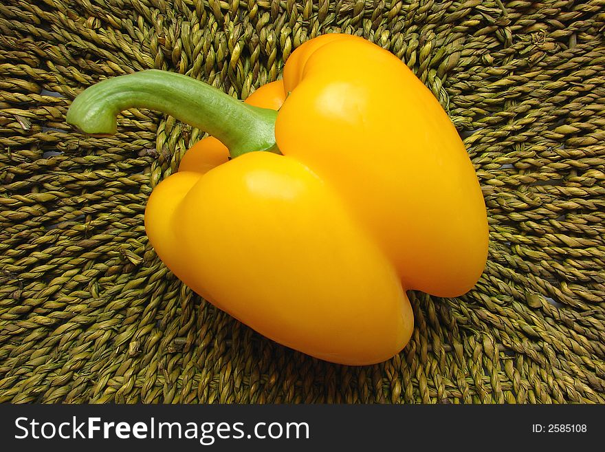 Yellow pepper in the green basket