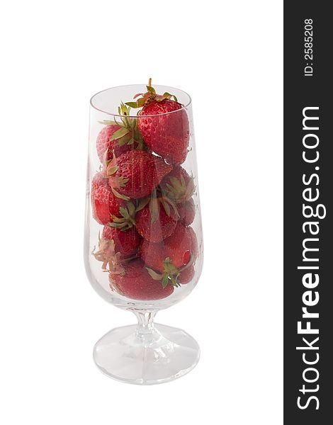 Wine glass with strawberries isolated on white