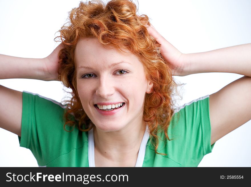 Beautiful young woman wearing a green shirt laughing. Beautiful young woman wearing a green shirt laughing