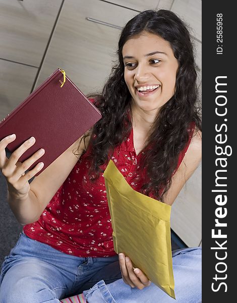 Girl with envelope in her hands. Girl with envelope in her hands