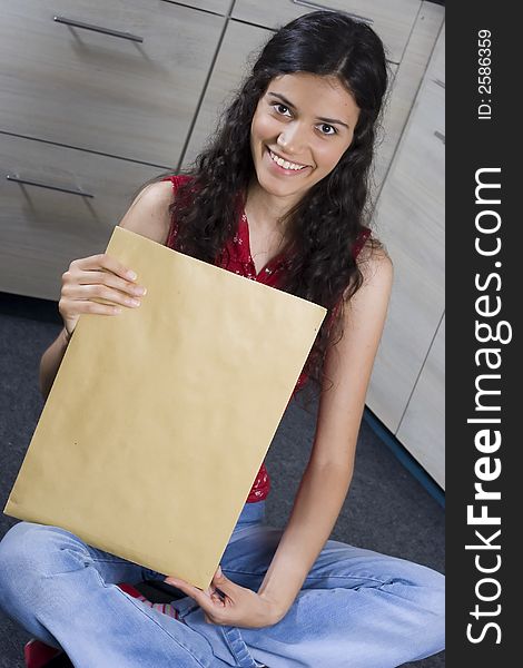 Girl with envelope in her hands. Girl with envelope in her hands