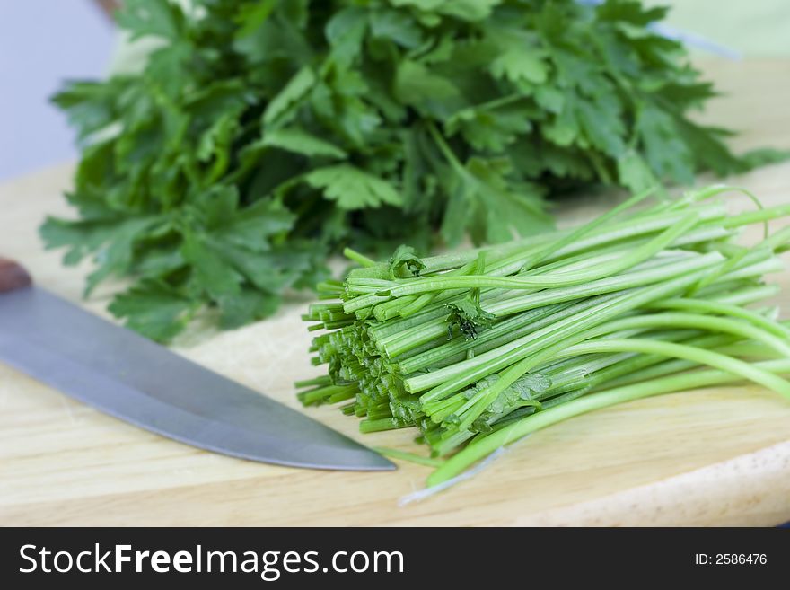 Fresh green parsley and knife