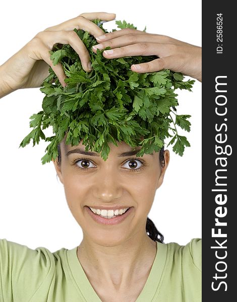 Pretty girl holding parsley on her head. Pretty girl holding parsley on her head
