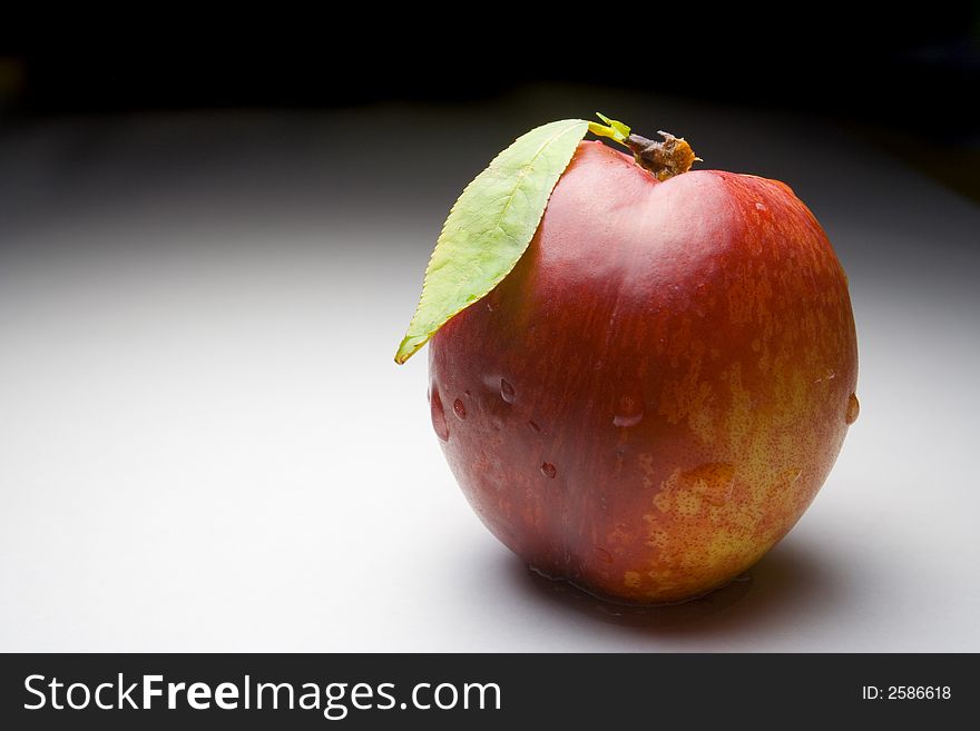 Fresh nectarine with water drops