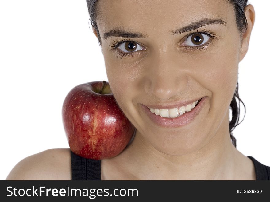Smiling girl holding apple on her kneck. Smiling girl holding apple on her kneck