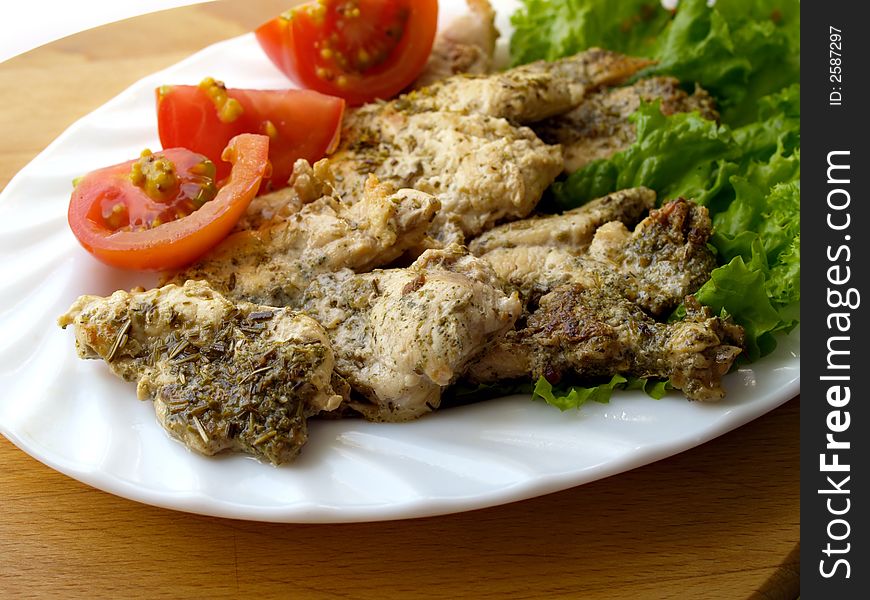 Vegetables and chicken filet with herbs and spice