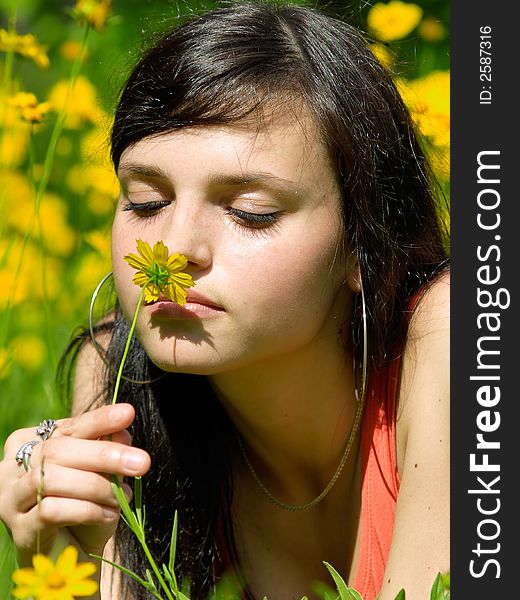 Young girl with  camomile