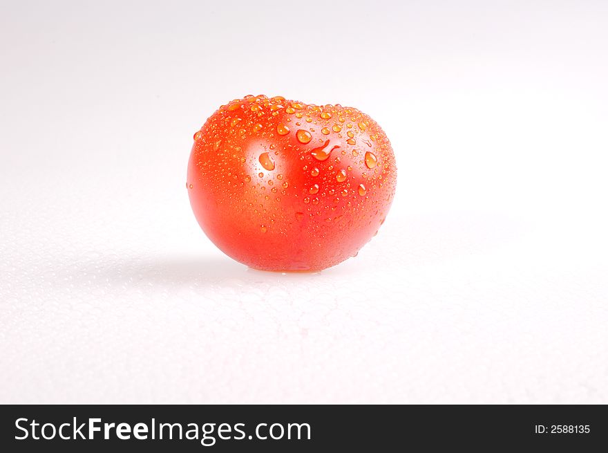 Proud red tomato on the bright background