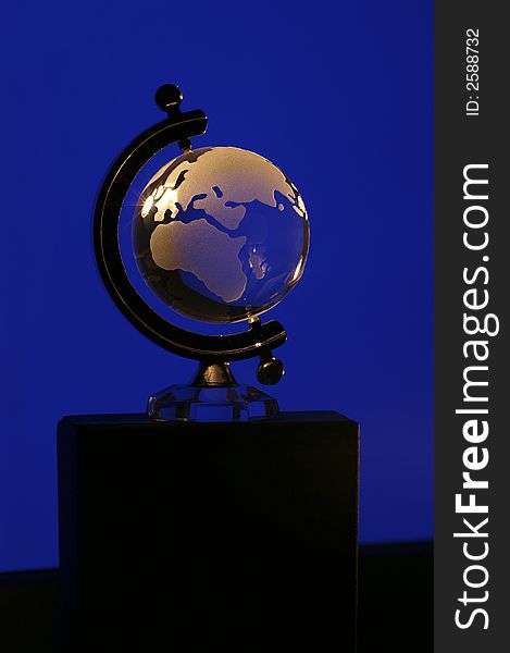 Glass globe on a blue background