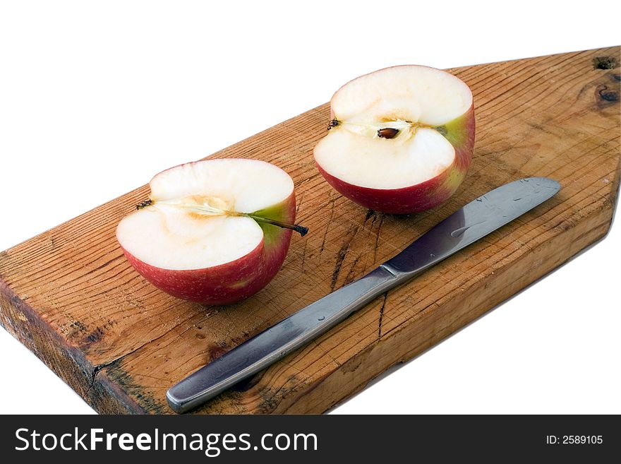 Two half of apple and knife on chopping board isolated on white with shadow