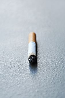 Stub Of Cigarette On The Ground Royalty Free Stock Image
