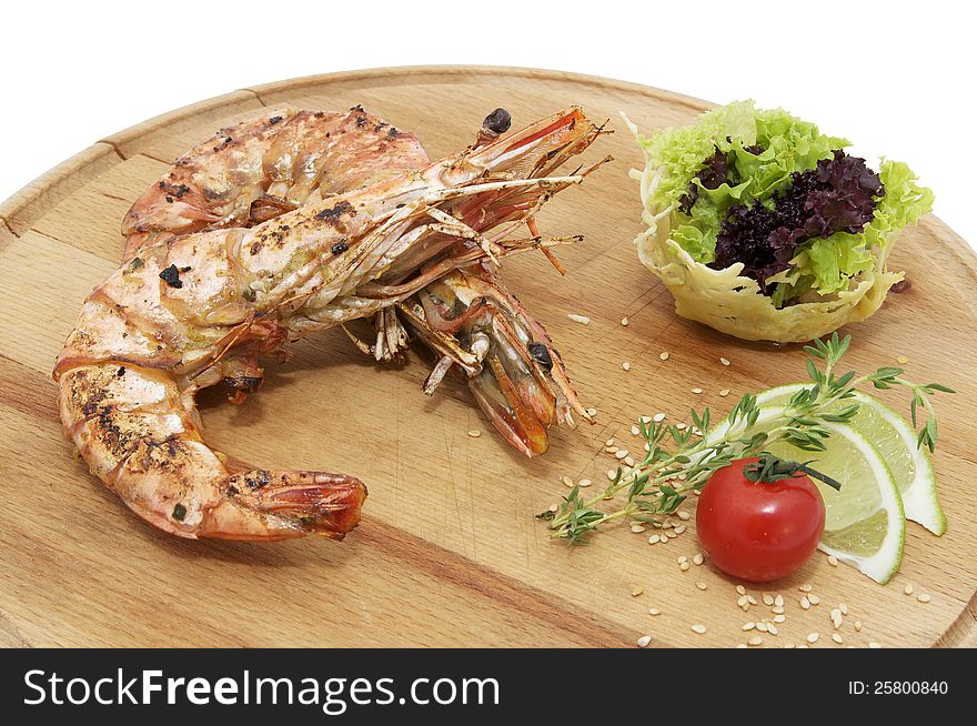 Grilled Shrimp with Orange on a wooden plate