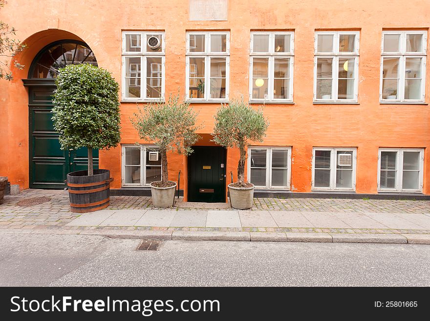 Danish office building painted in traditional orange coloured paint. Danish office building painted in traditional orange coloured paint