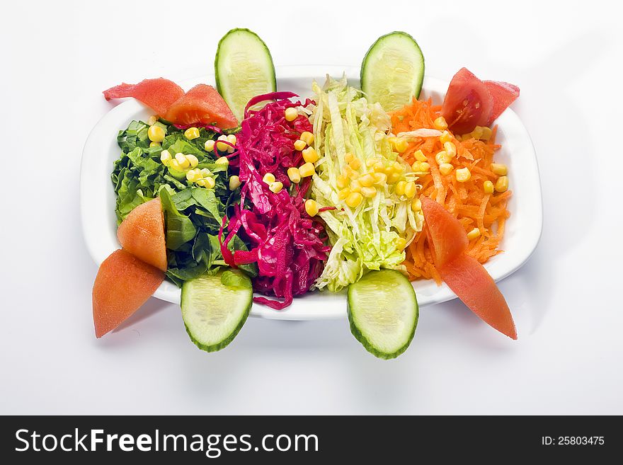 Fresh salad bowl on white background