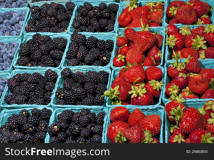 Strawberries, blackberries, and blueberries on display. Strawberries, blackberries, and blueberries on display