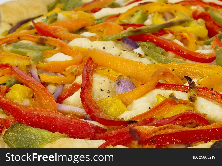 Close up of tri-color peppers and onion foccacia; vegetarian pizza;. Close up of tri-color peppers and onion foccacia; vegetarian pizza;