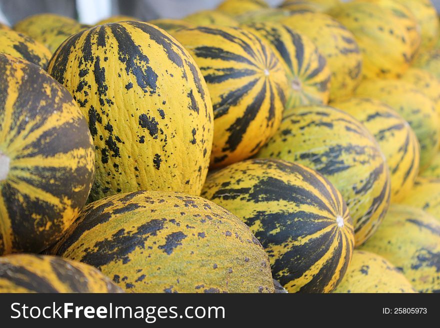Yellow and green melons at the market stand from Turkey