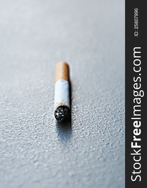 Stub of cigarette on the ground