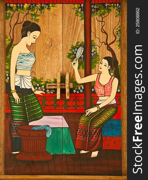 Thai painting of women. The painting is placed in the frame.