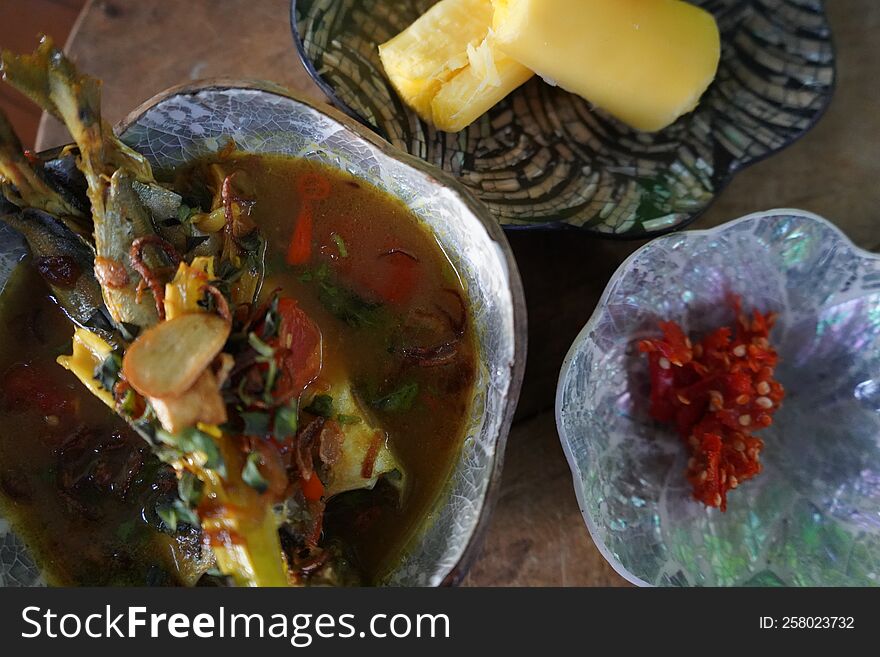 Fish Soup With Casava On The Wooden Table