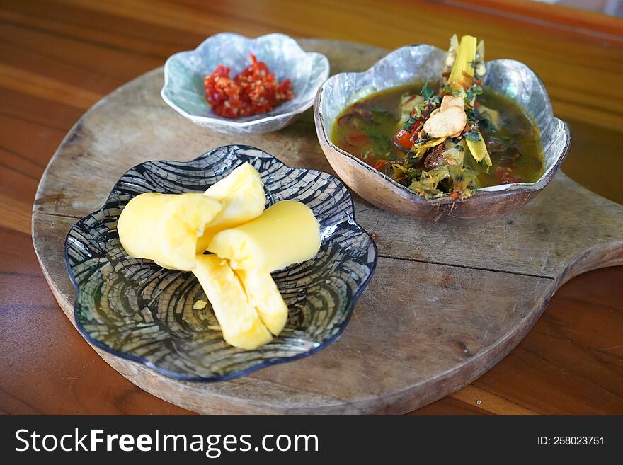 Fish Soup with casava on the wooden table