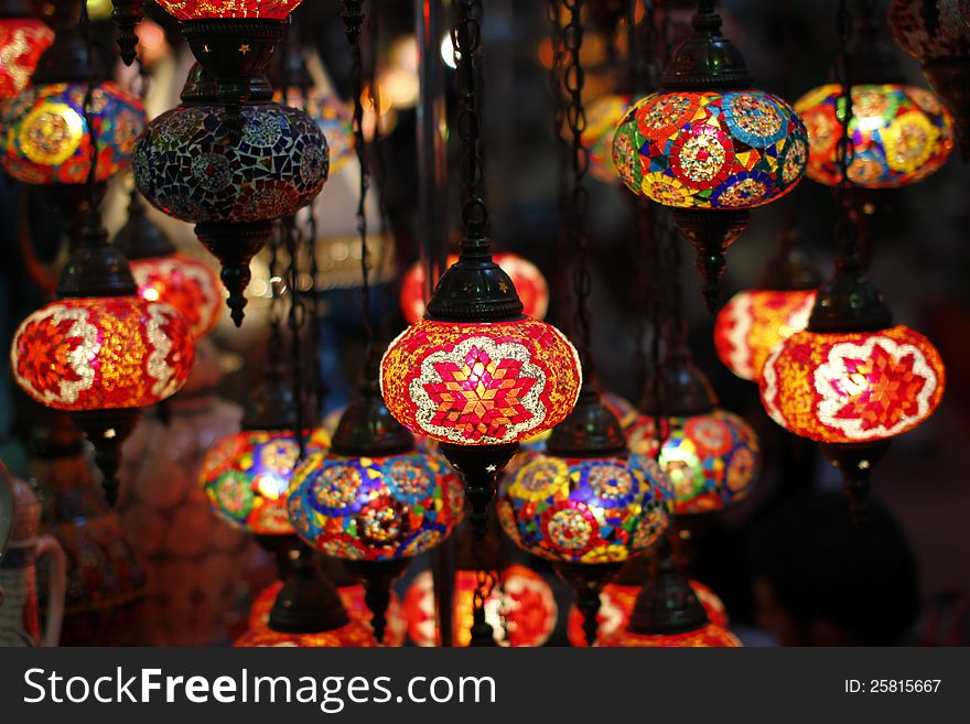 A display of arabic lamps and lanterns and lights in a market. A display of arabic lamps and lanterns and lights in a market