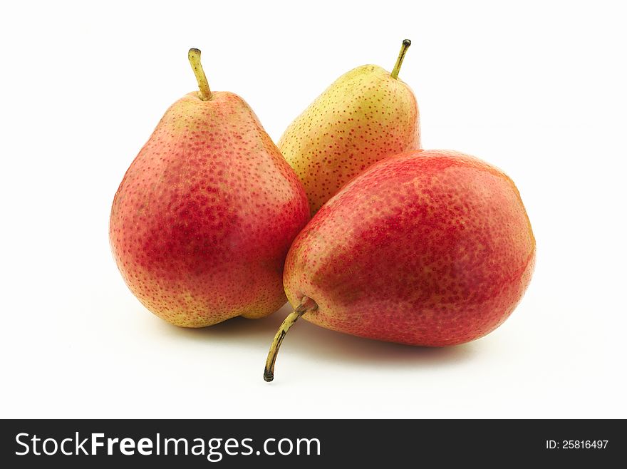 Three delicious red pears on white background. Three delicious red pears on white background