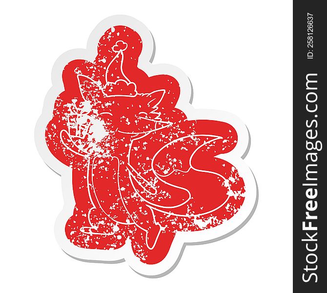 Cartoon Distressed Sticker Of A Happy Fox Wearing Santa Hat