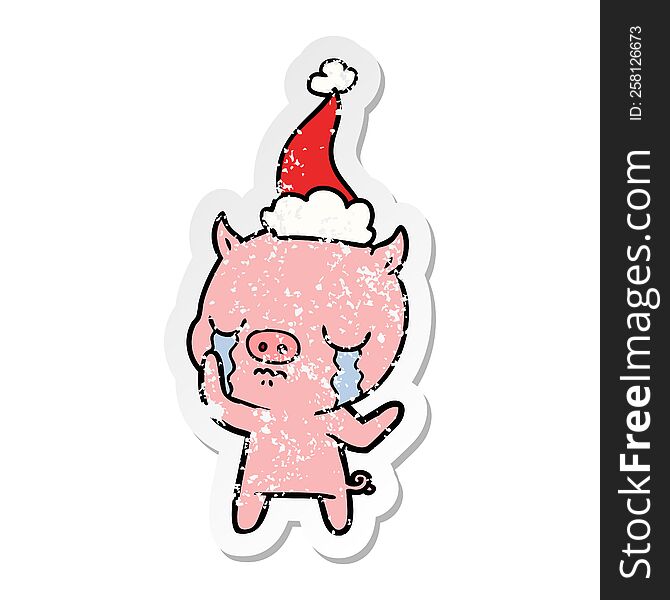 Distressed Sticker Cartoon Of A Pig Crying Wearing Santa Hat