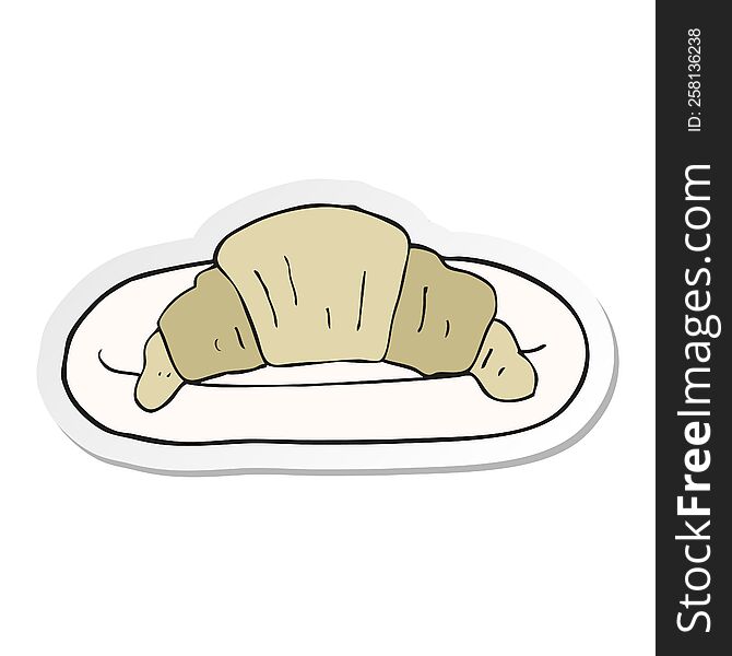 sticker of a cartoon croissant