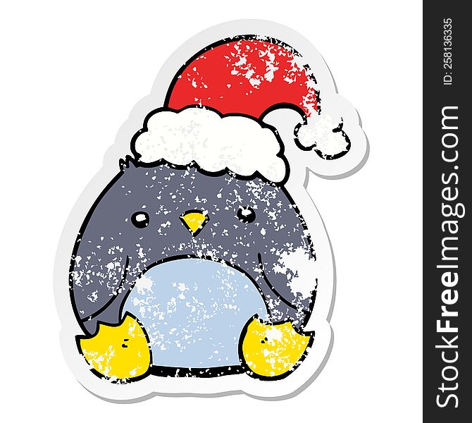 distressed sticker of a cute cartoon penguin wearing christmas hat