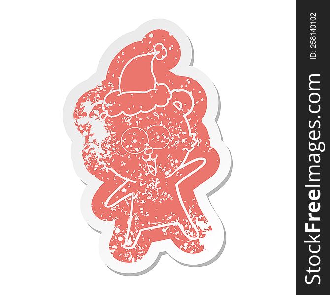 laughing teddy  bear quirky cartoon distressed sticker of a wearing santa hat